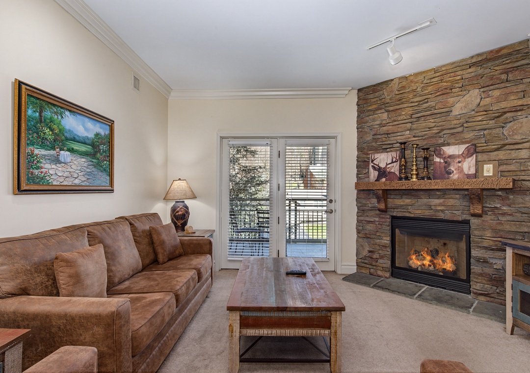 Curl up by your crackling stone fireplace with rustic charm and nature art, while French doors invite mountain breezes.