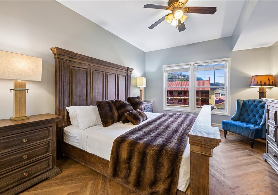 Sink into plush bedding and luxurious fur throws in your elegantly appointed bedroom, where rustic charm meets modern comfort for ultimate relaxation.