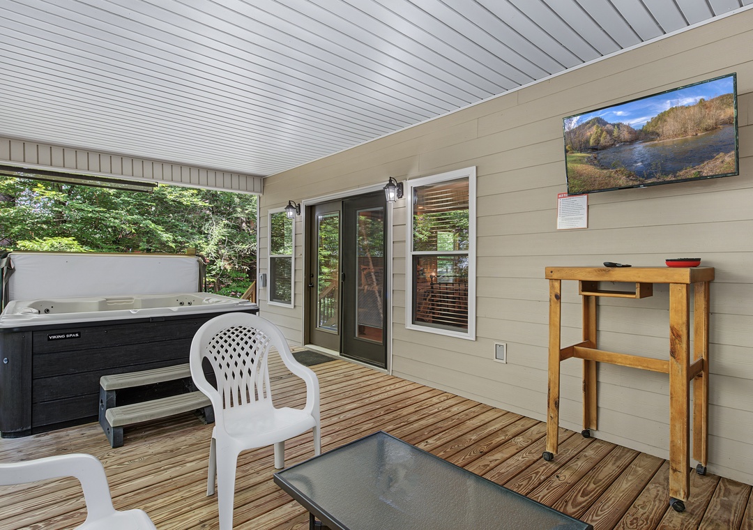 Your private deck offers the perfect retreat—soak in the hot tub, gather at the outdoor table, or unwind with scenic views on the wall-mounted TV.