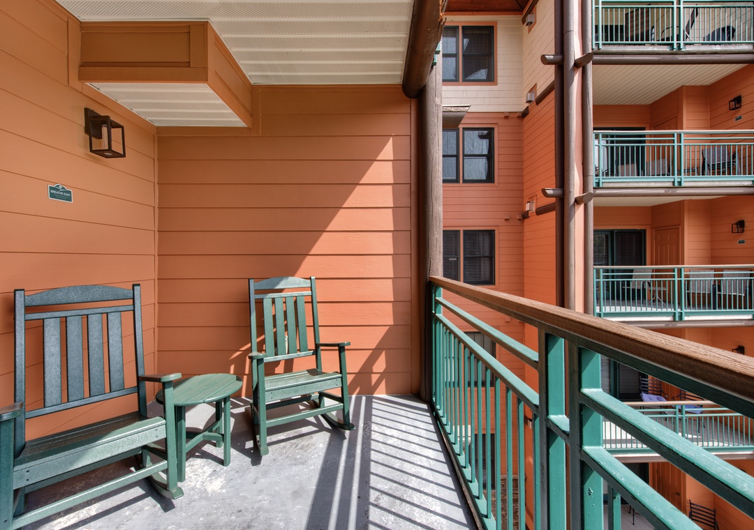 Unwind on your private balcony with comfortable rocking chairs, perfect for morning coffee or watching the day unfold.