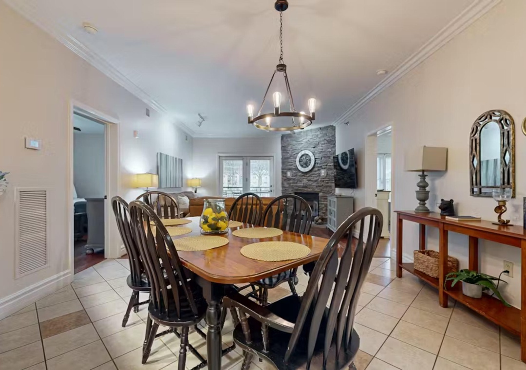 Gather around your elegant dining table for memorable meals, with the cozy living area just steps away for post-dinner relaxation.