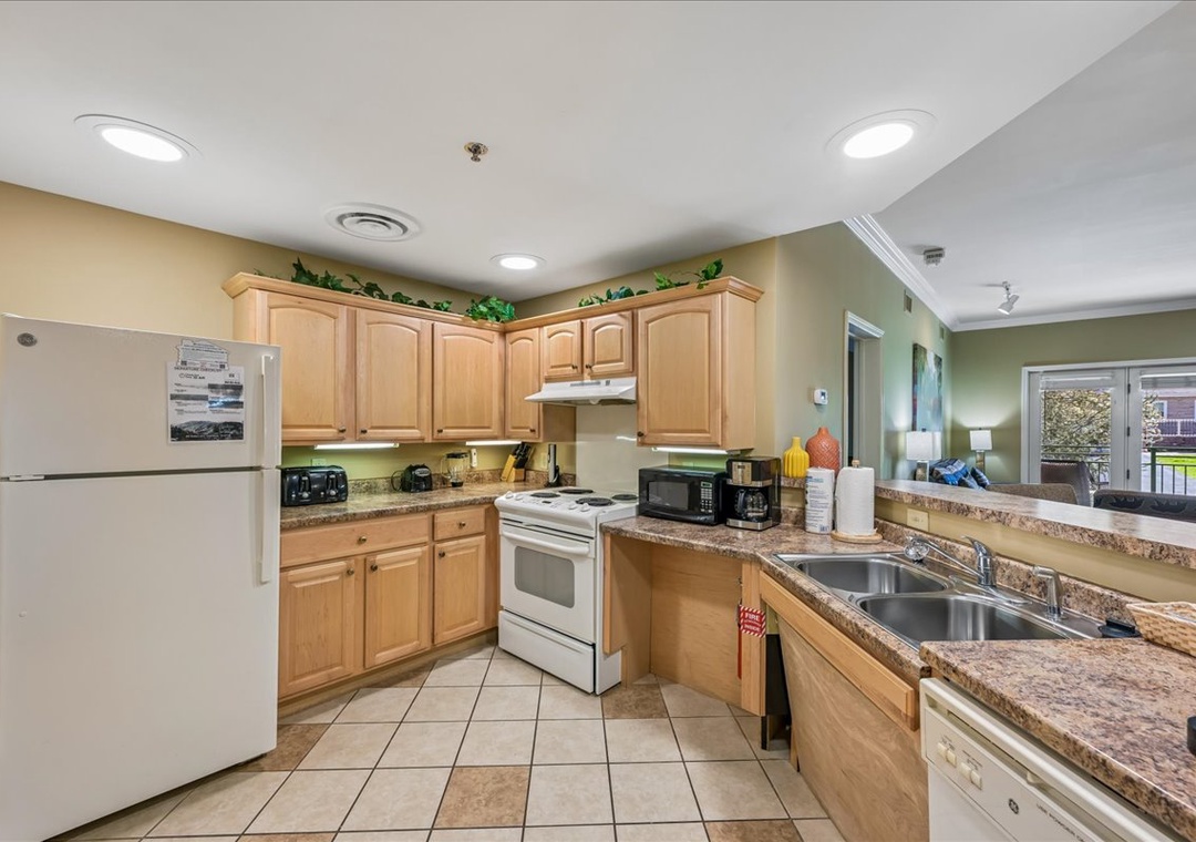 Your fully equipped kitchen awaits with granite counters, modern appliances, and everything you need to prepare delicious meals during your stay.