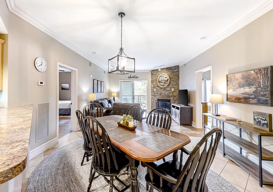 Gather around your elegant dining table, where warm lantern light creates perfect ambiance for memorable meals with loved ones.