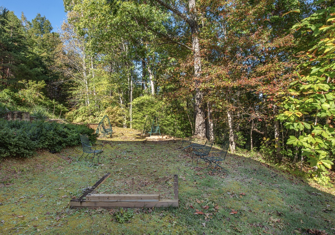 The property is nestled in a peaceful woodland setting, offering abundant natural beauty and privacy throughout the seasons.