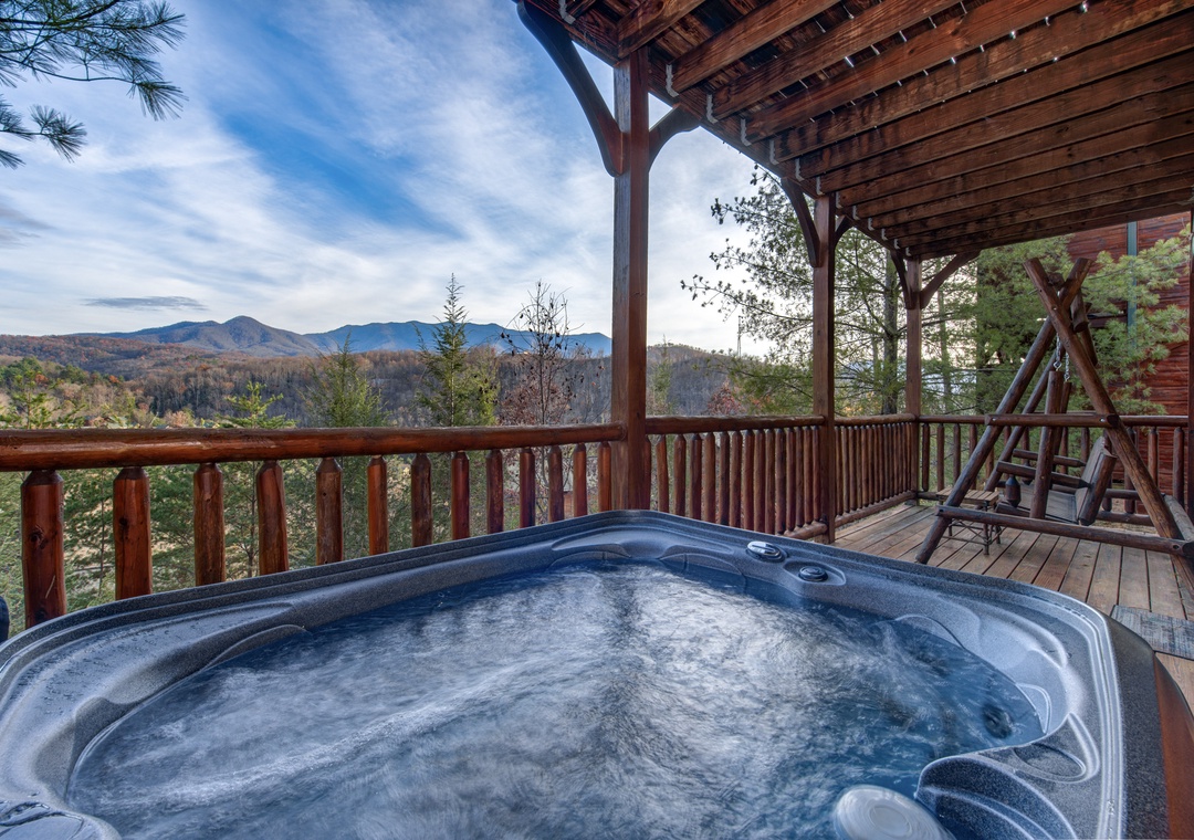 Soak away your cares in the bubbling hot tub on your private deck, where sweeping mountain panoramas and peaceful forest views stretch endlessly before you.
