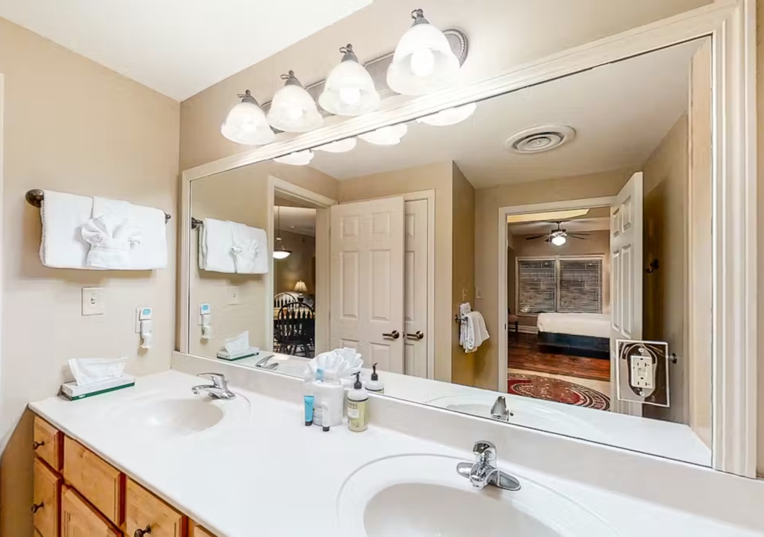 Your spacious master bathroom features dual vanities and bright lighting, perfect for your morning routine.