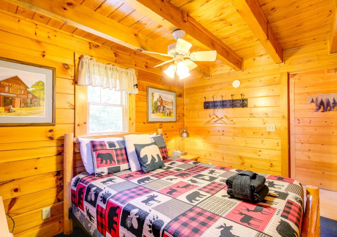 Cozy cabin bedroom with rustic charm, plaid bedding, and woodland décor creates your perfect mountain retreat sanctuary.