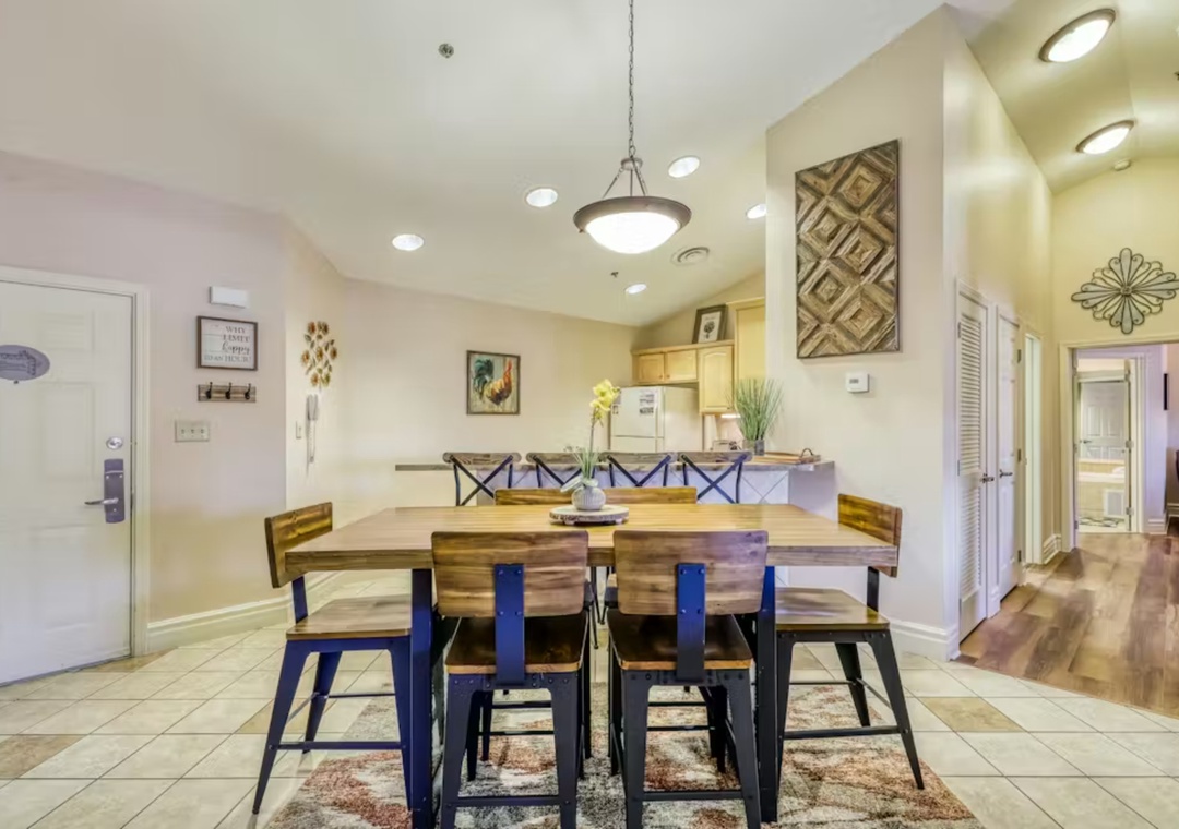 Share memorable meals around your spacious dining table, where warm wood tones and stylish decor create the perfect setting for family gatherings.