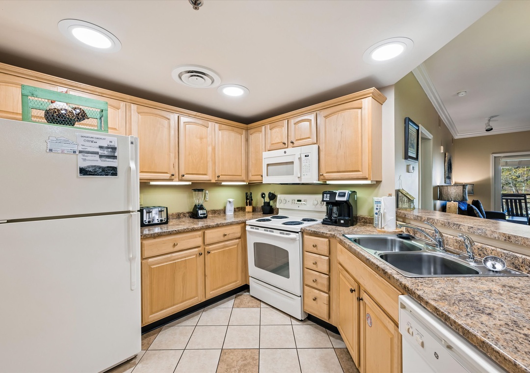 Your fully equipped kitchen features granite countertops, modern appliances, and ample cabinet space for preparing memorable meals during your stay.
