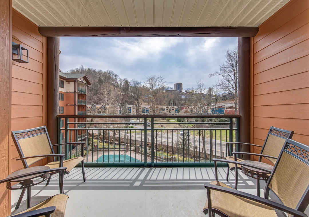 Step onto your private balcony and unwind in comfortable seating while enjoying peaceful pool views and the surrounding neighborhood.