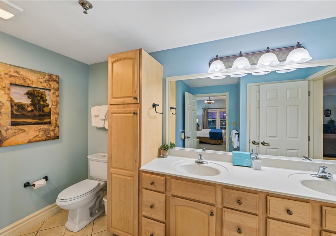 Unwind in your spacious en-suite with double vanities, ample storage, and calming coastal colors.