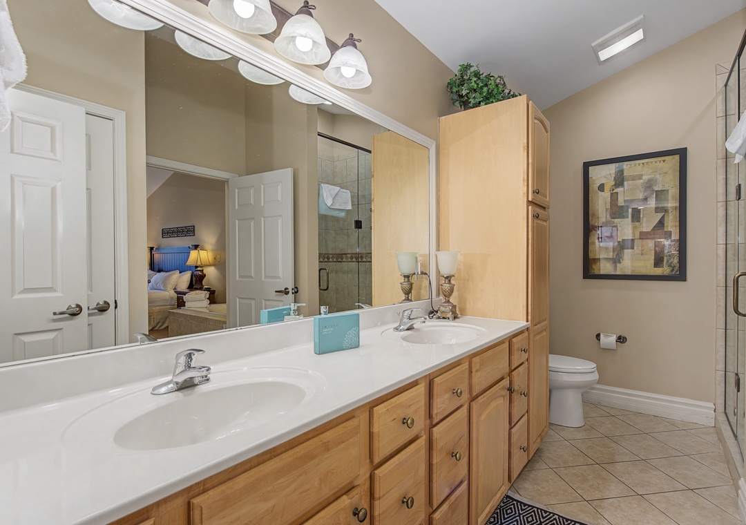 Step into your private retreat featuring a spacious vanity with dual sinks, perfect for getting ready.