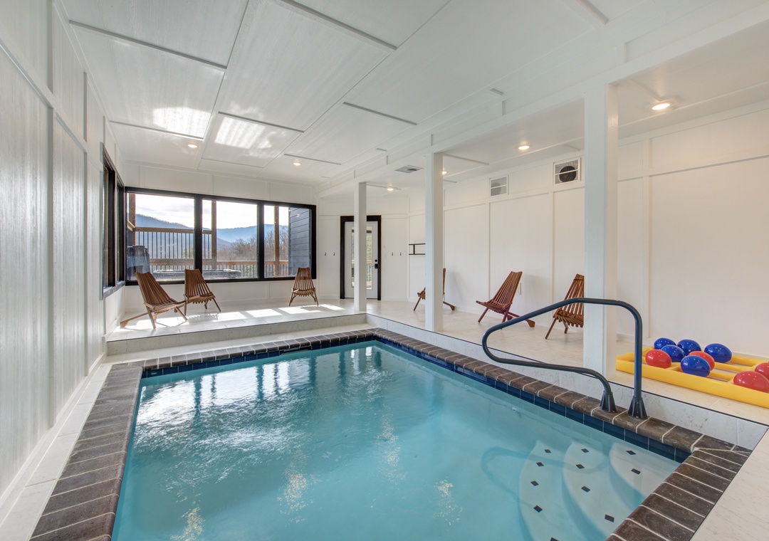 Your private indoor pool awaits with stunning mountain views, perfect for relaxing year-round in complete comfort.