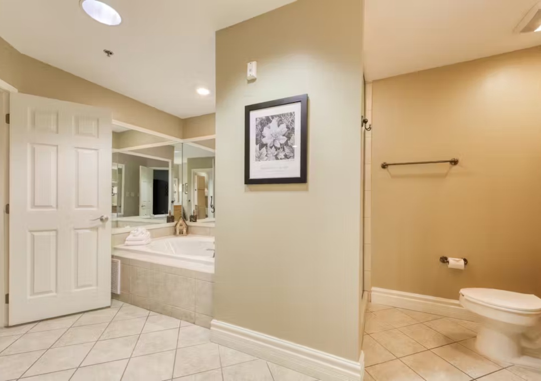 Unwind in your spacious bathroom featuring a luxurious jetted tub, separate shower, and elegant finishes that make every moment feel like a spa retreat.
