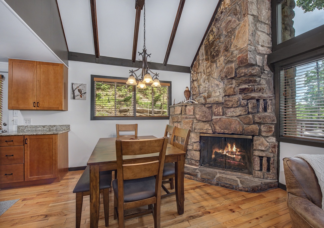 Gather around the table by your own crackling fireplace, framed by soaring beamed ceilings and natural light—perfect for cozy meals and warm conversations after mountain adventures.
