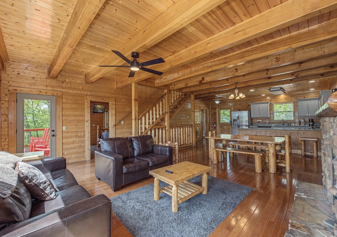 Relax in this stunning log cabin with exposed beams, leather seating, and open-plan design connecting living and kitchen spaces perfectly.