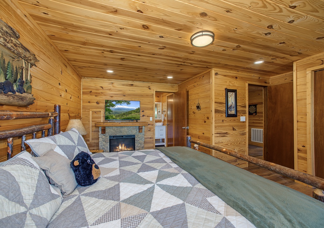 Wrap yourself in the warmth of knotty pine walls and your own cozy fireplace. Rustic log accents and soft lighting create a peaceful mountain retreat where you can unwind after a day of adventure.