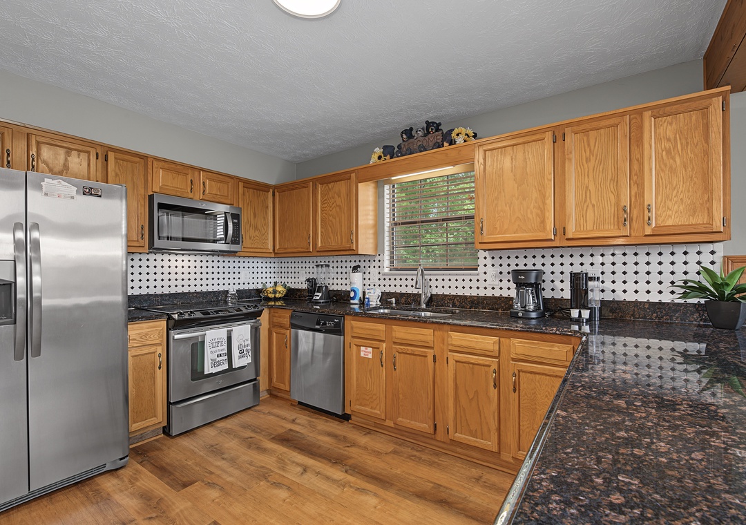 Your fully equipped kitchen features granite countertops, modern stainless steel appliances, and ample counter space for preparing home-cooked meals during your stay.