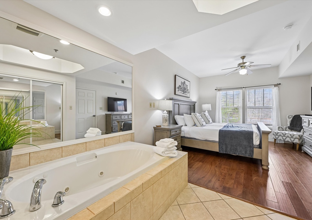 Your luxurious master suite features a spacious bedroom and indulgent soaking tub, perfect for unwinding after exploring.