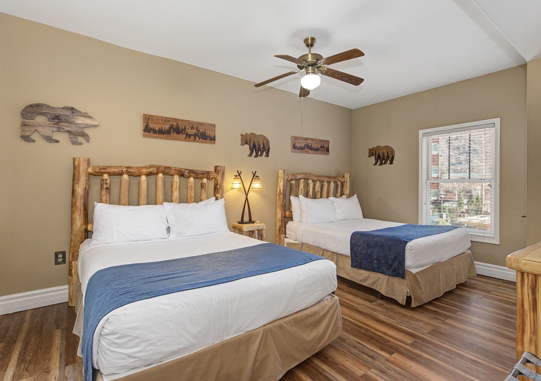 Rest easy in your rustic retreat with cozy log-framed beds and charming wilderness decor that brings nature indoors.