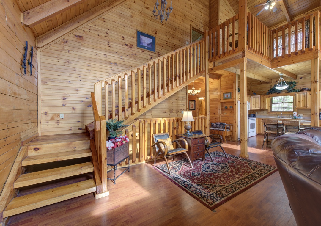Step into this stunning log cabin where rustic charm meets modern comfort, featuring soaring ceilings and warm wood throughout.