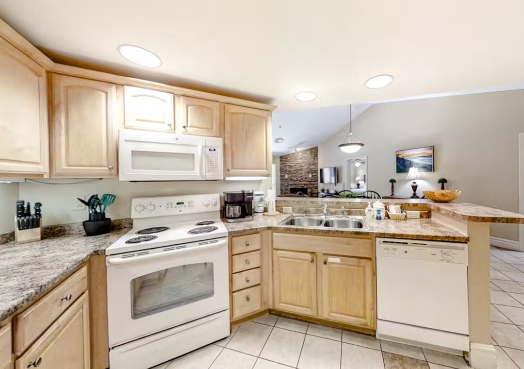 Your fully-equipped kitchen awaits with granite counters, modern appliances, and everything you need to create memorable meals together.