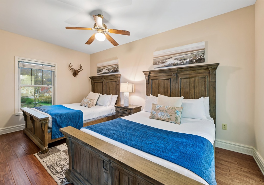 Rest peacefully in your rustic twin bedroom with handcrafted wooden beds, crisp linens, and charming mountain lodge décor.