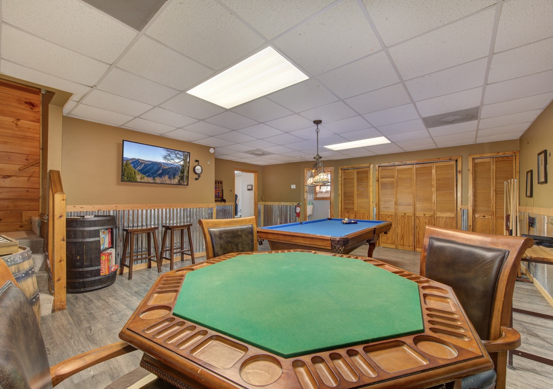 Your private game room awaits with billiards, poker table, and cozy fireplace for memorable evenings with friends and family.