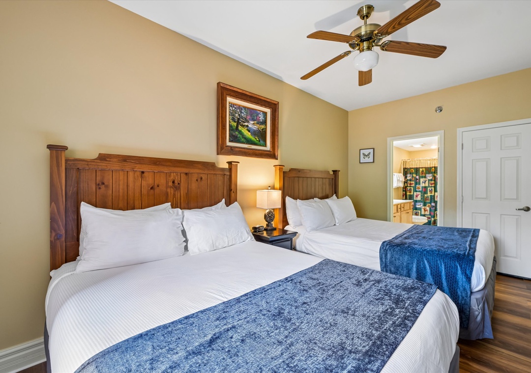 Sink into crisp white linens and rustic wood comfort while your ceiling fan keeps you perfectly cool throughout your stay.