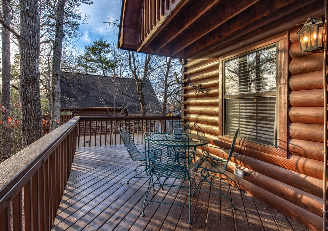 Step onto your private deck where morning coffee tastes better surrounded by towering trees and peaceful woodland views.