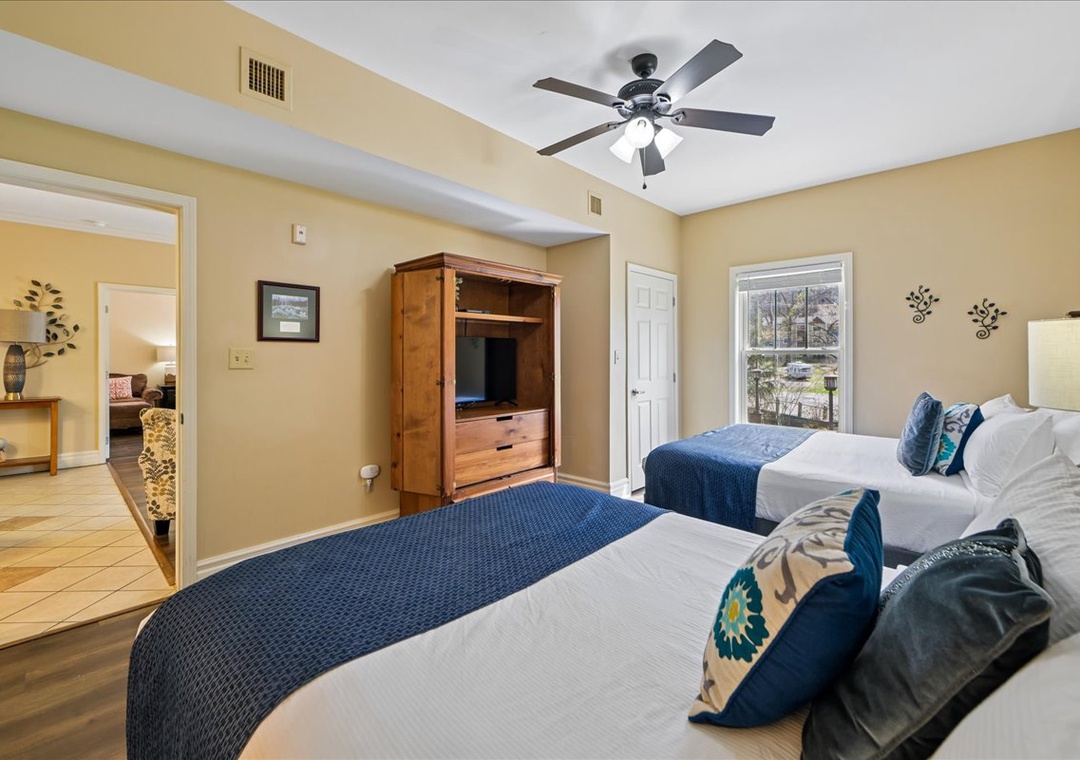 Drift off in comfort with twin beds dressed in soft linens, while your ceiling fan keeps you cool throughout the night.