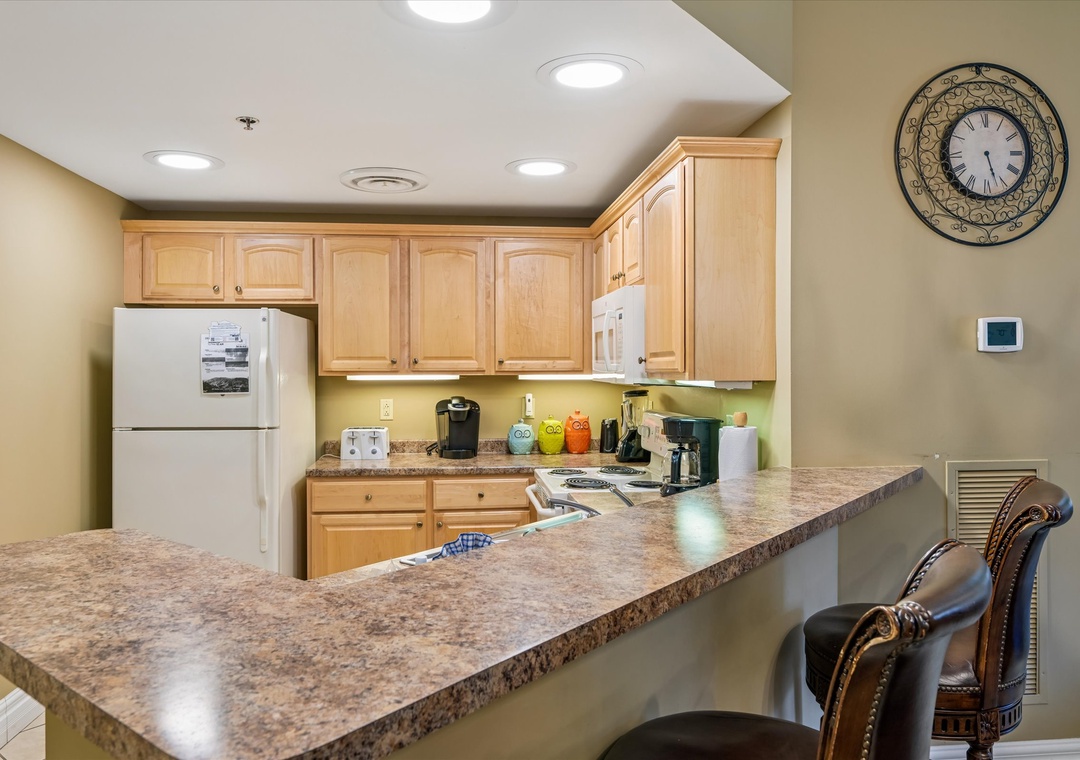 Your fully equipped kitchen features granite counters, modern appliances, and everything needed for home-cooked meals during your stay.