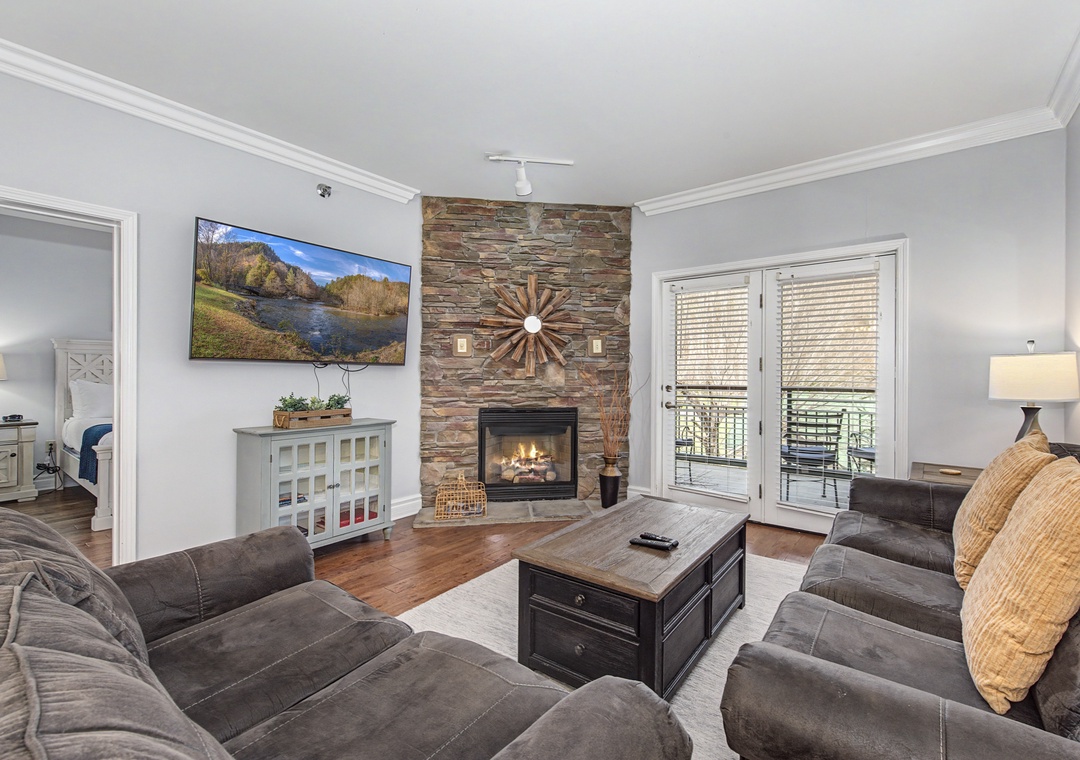 Sink into plush sofas by the stone fireplace while you watch your favorite shows on the large TV.