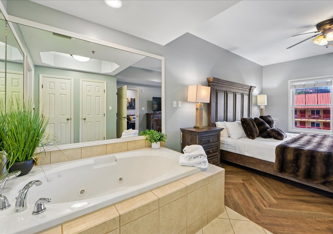 Unwind in your romantic suite featuring a luxurious jetted tub and plush king bed for the ultimate retreat.