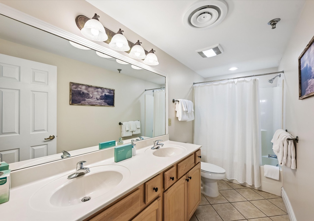 Refresh in your spacious bathroom with dual sinks, perfect for getting ready together, and a relaxing shower to unwind after your adventures.