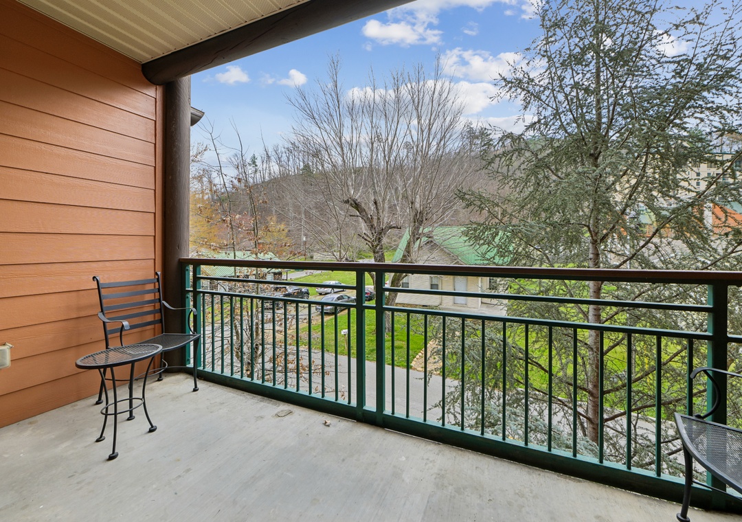 Step onto your private balcony and breathe in the fresh air while enjoying peaceful views of the surrounding neighborhood and lush greenery.