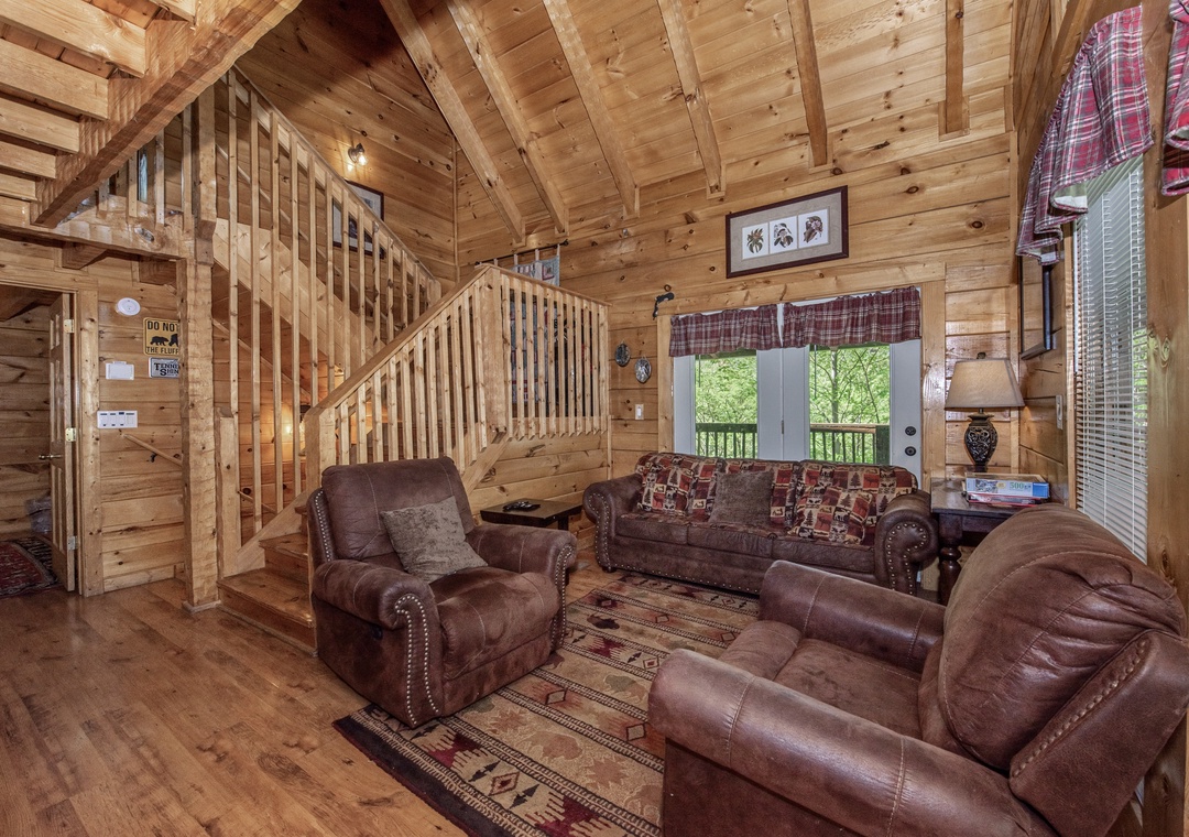 Sink into rustic luxury with plush leather seating and warm wood beams creating your perfect mountain retreat atmosphere.