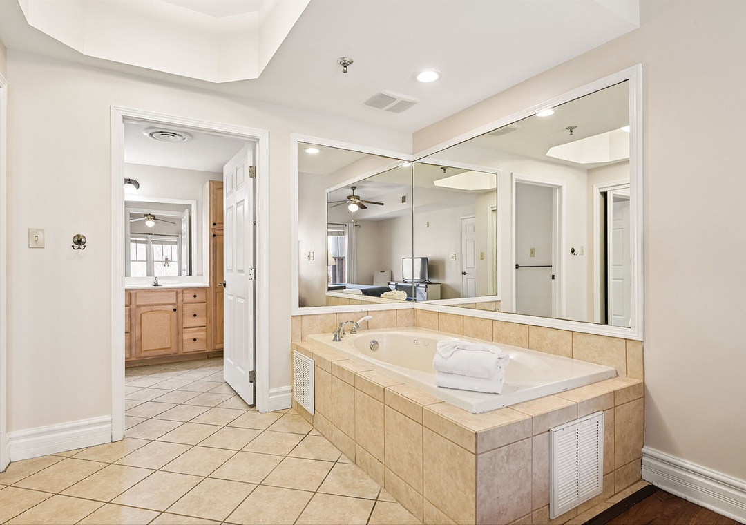 Unwind in your spacious master bathroom with a luxurious soaking tub, perfect for relaxing after a day of adventures.