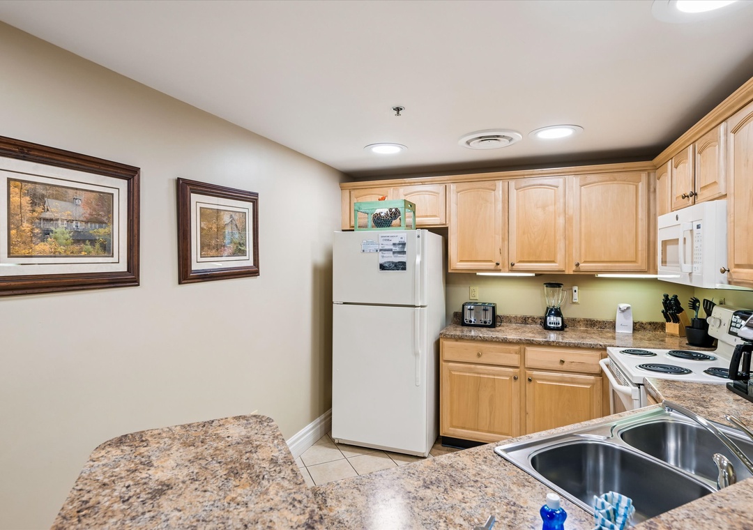 Your fully equipped kitchen lets you prepare meals at your own pace, with granite counters and all appliances needed.