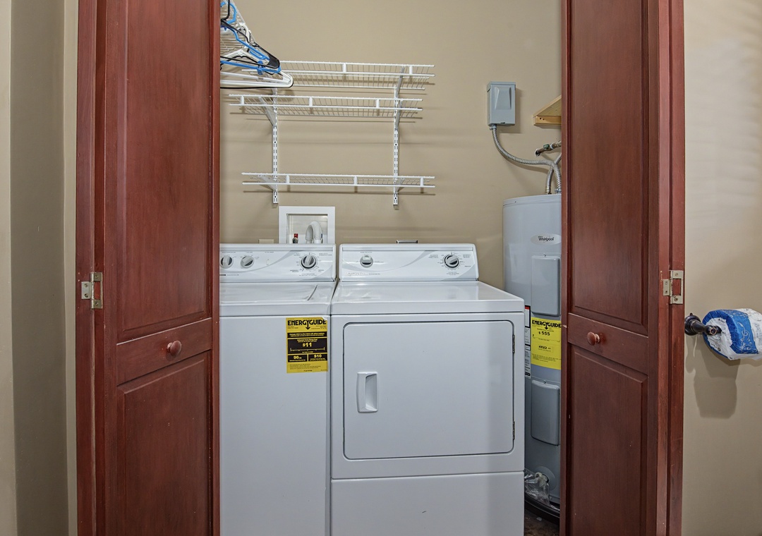 Keep your wardrobe fresh with convenient in-unit laundry facilities, featuring a full-size washer and dryer with organized shelving.