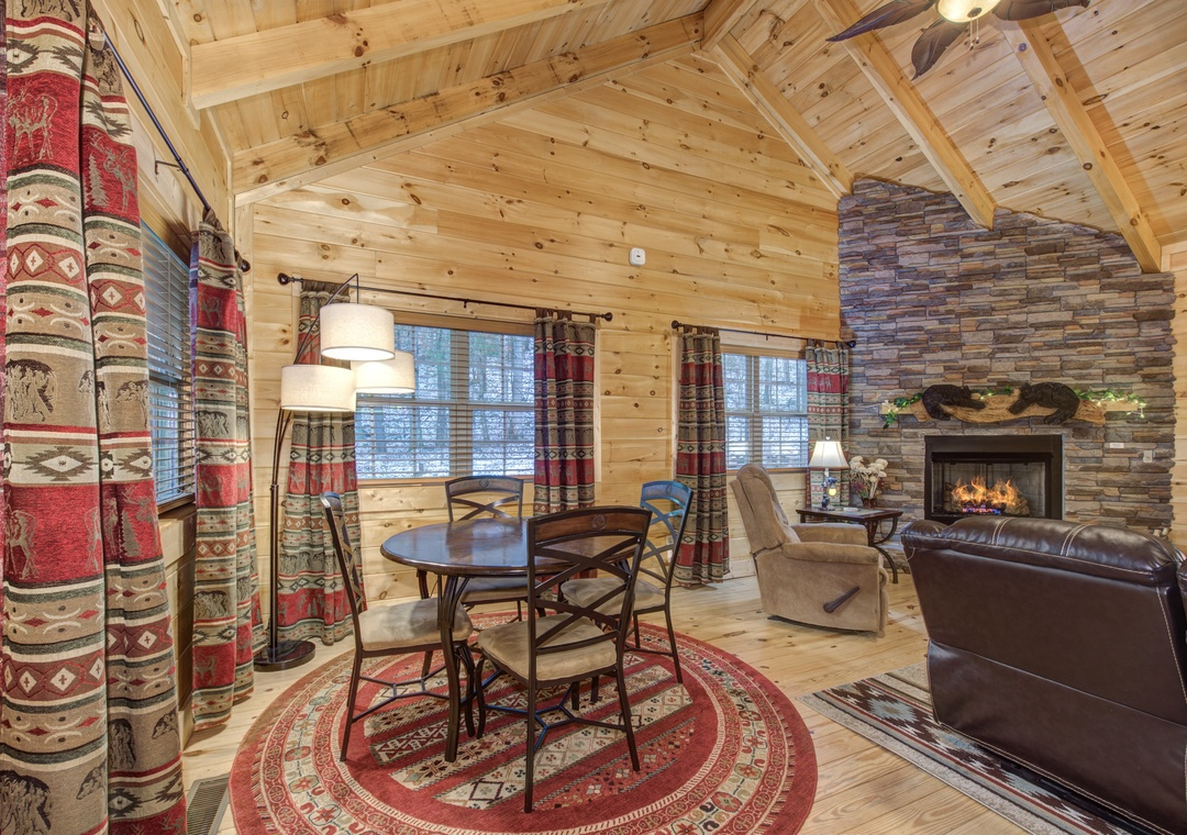 Cozy up in this stunning log cabin with soaring ceilings, stone fireplace, and rustic charm that makes every moment feel like a mountain retreat.