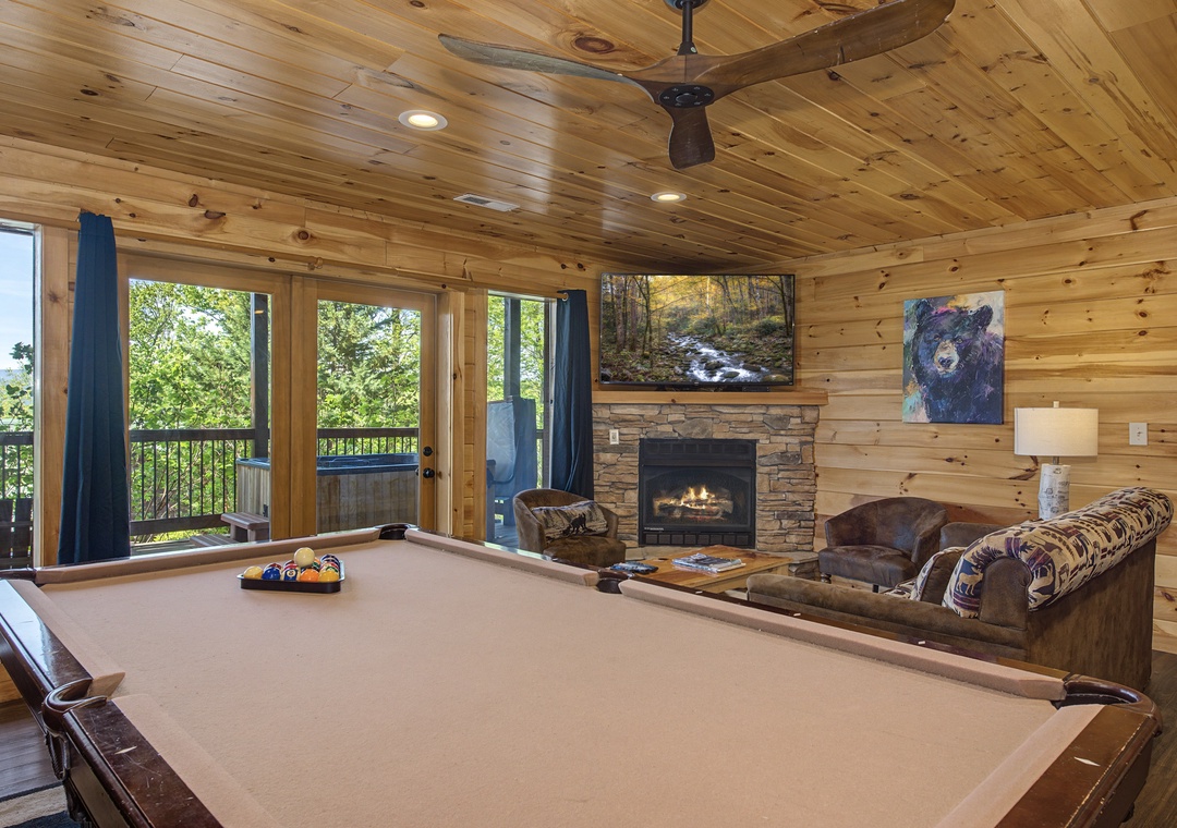 Gather around your private pool table for friendly competitions while the fireplace crackles nearby, creating perfect mountain retreat vibes.