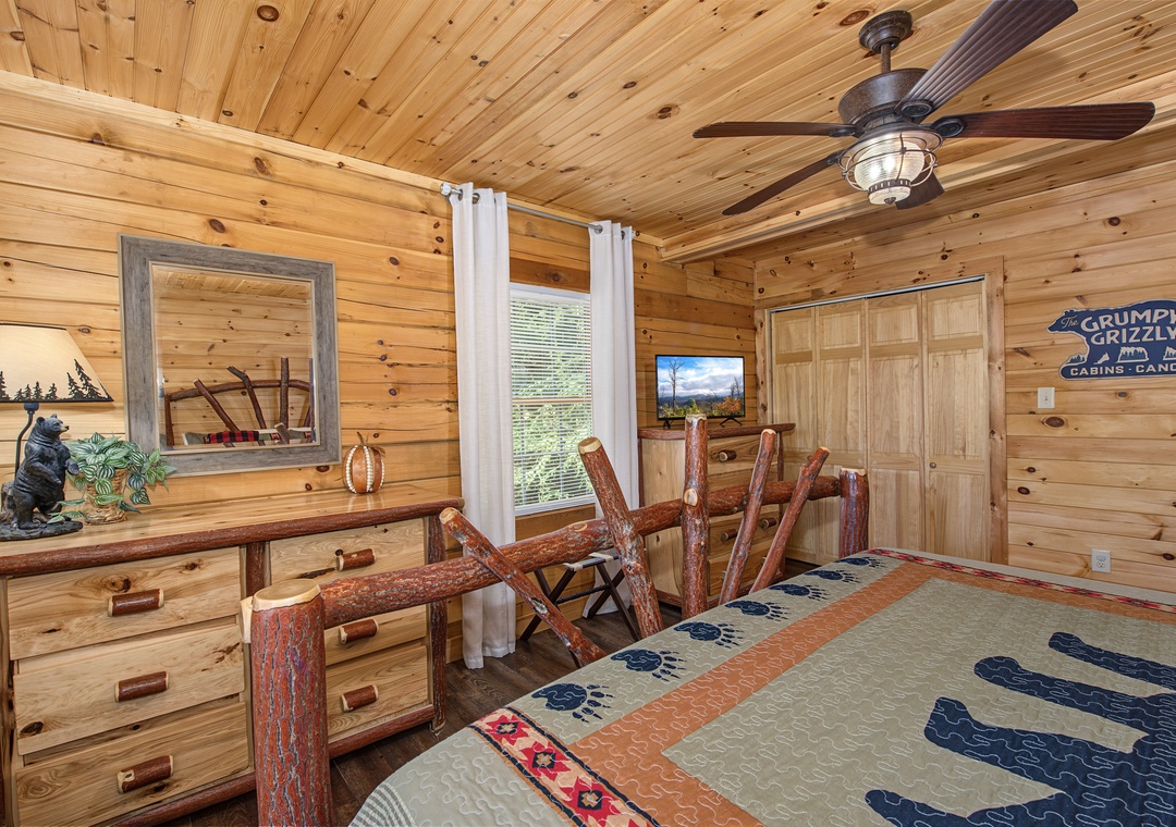 Your rustic retreat features handcrafted log furnishings and warm pine accents, creating a cozy cabin atmosphere that welcomes you at the end of an adventure-filled day.