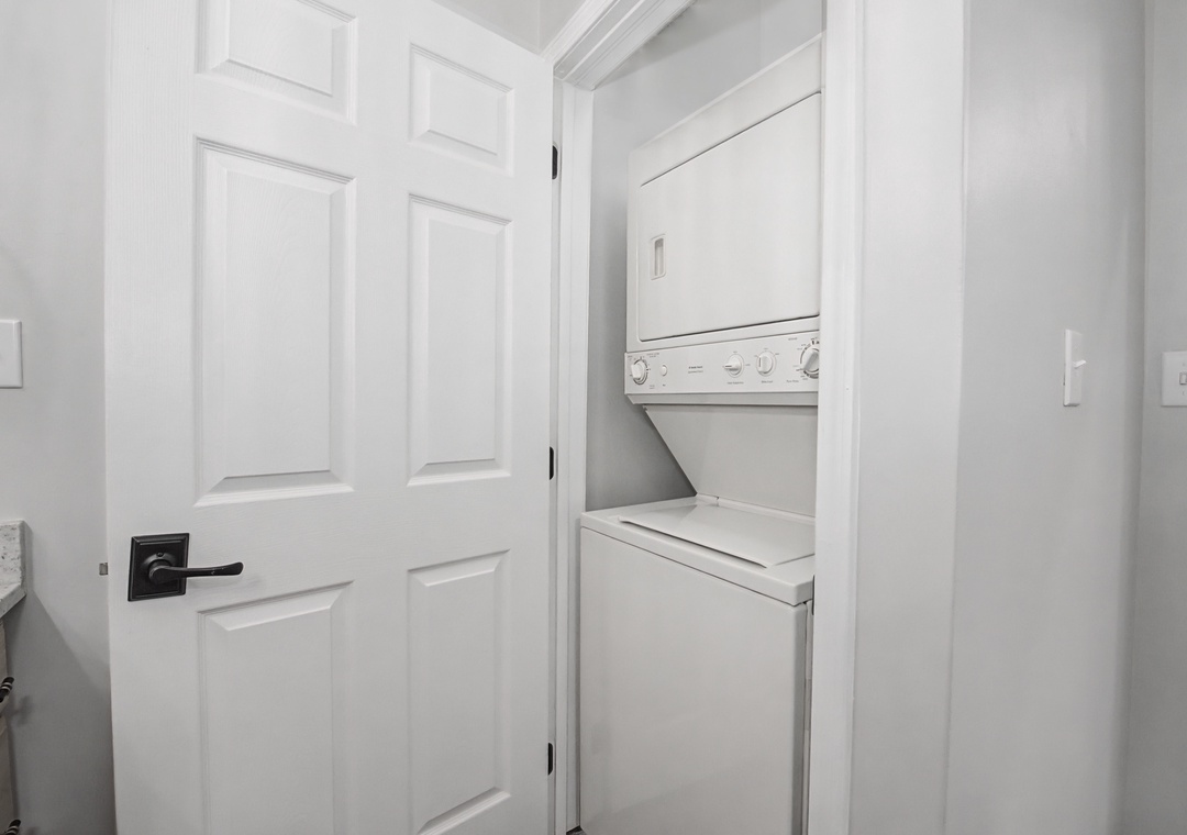 Your in-unit washer and dryer await in this convenient closet, making extended stays effortless with fresh laundry at your fingertips.