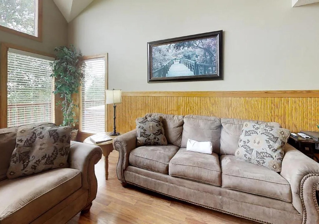 Sink into plush sofas in your sun-filled living room, where vaulted ceilings and warm wood accents create the perfect retreat after exploring the nearby trails.