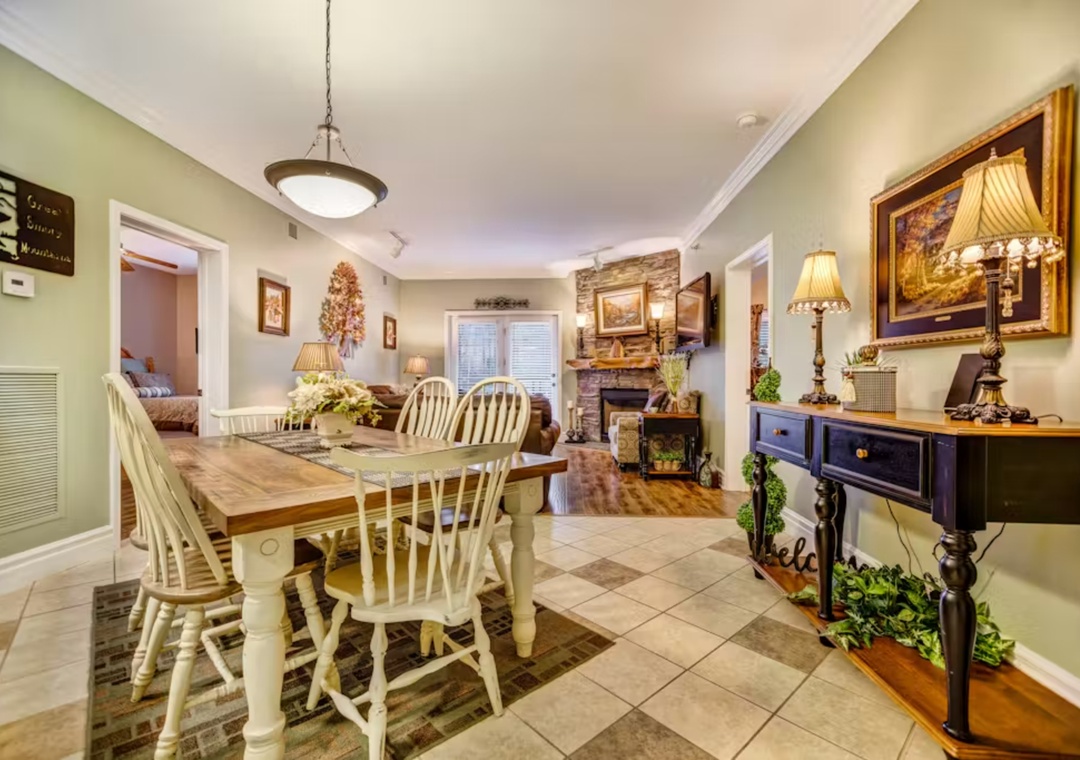 Gather around this charming farmhouse table where your morning coffee and evening conversations will feel extra special in this warm, inviting space.