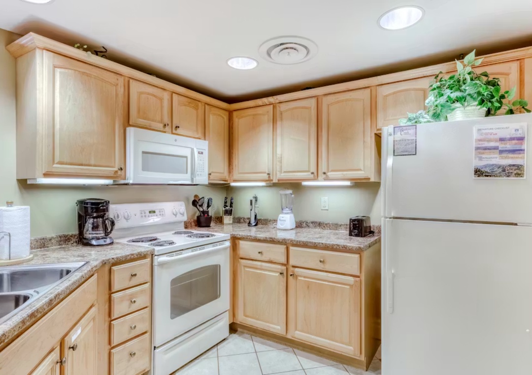Your fully equipped kitchen awaits with granite counters, all appliances, and everything needed to whip up memorable meals during your stay.