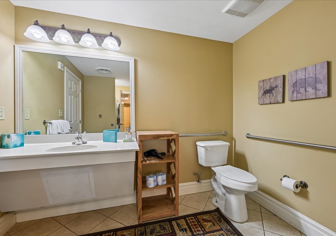 Your spacious bathroom features bright vanity lighting, ample counter space, and thoughtful storage to help you feel at home.
