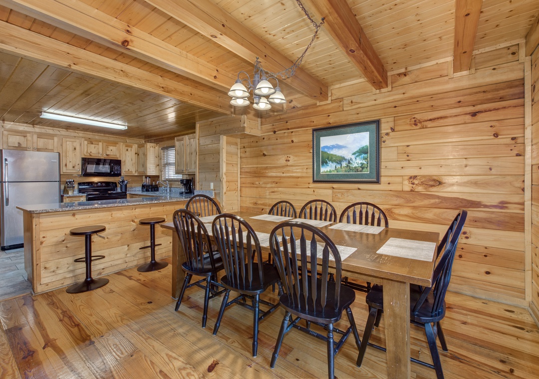 Gather around this spacious wooden dining table where your group can share memorable meals in the warm, rustic charm of natural wood.