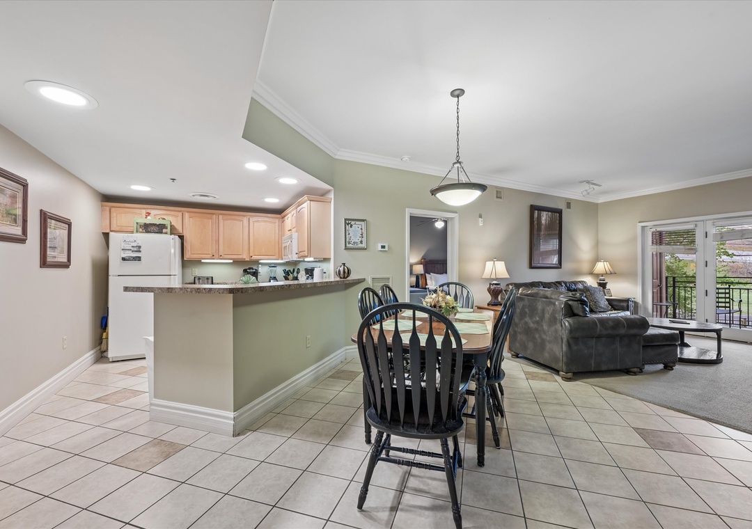 Relax in your open-concept living space where kitchen, dining, and living areas flow seamlessly together for memorable vacation moments.